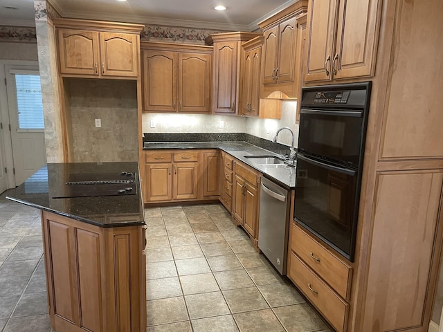 kitchen with ornamental molding, dark stone countertops, black appliances, and sink