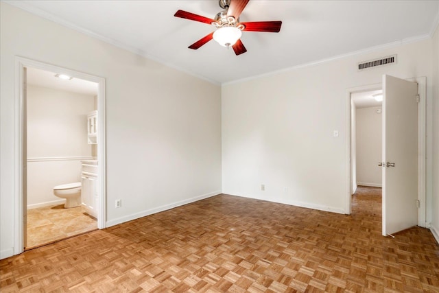 unfurnished bedroom featuring ensuite bathroom, parquet floors, ornamental molding, and ceiling fan