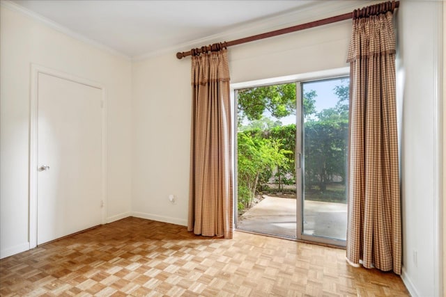 doorway featuring light parquet flooring and ornamental molding