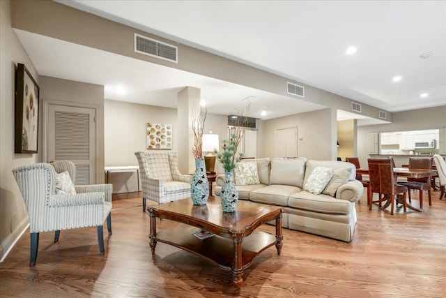 living room with light hardwood / wood-style floors