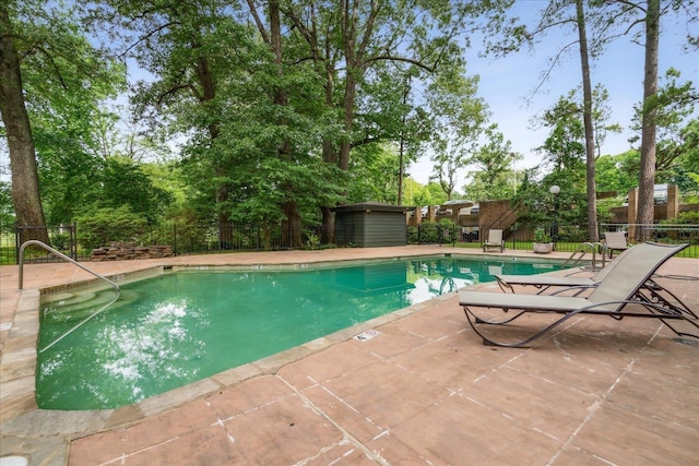 view of swimming pool with a patio area