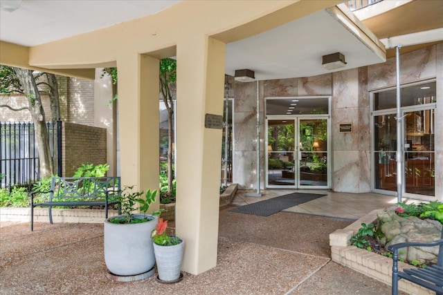 doorway to property featuring a patio area and french doors