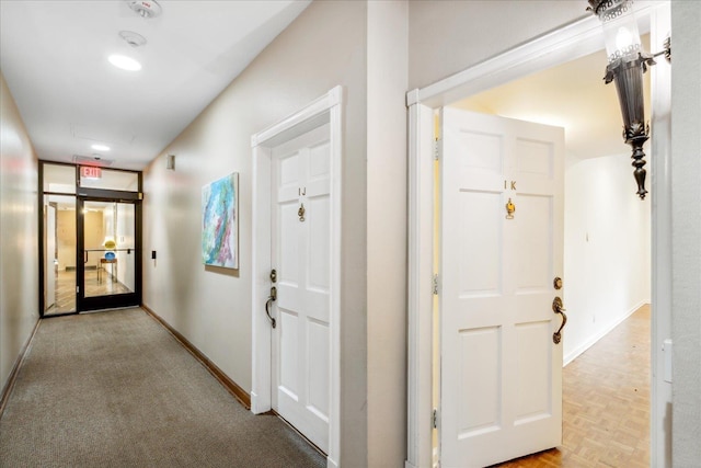 corridor featuring light parquet flooring