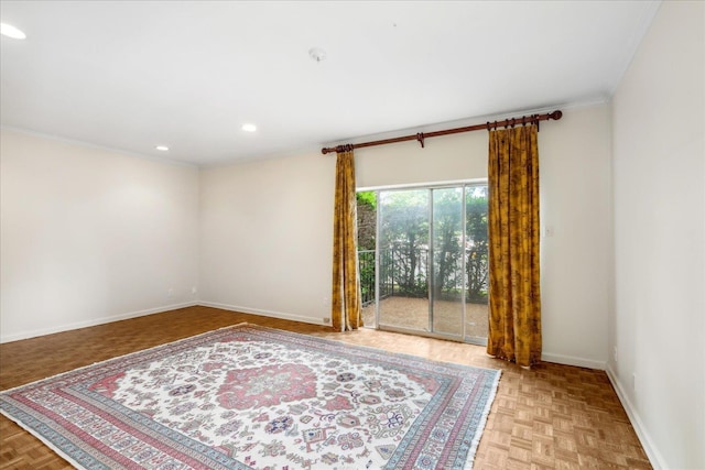 empty room featuring light parquet floors and ornamental molding