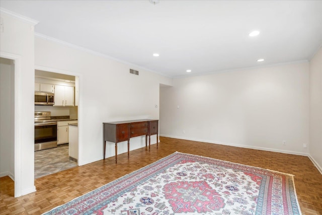 spare room featuring crown molding and light parquet flooring