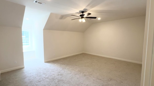 bonus room with visible vents, carpet flooring, vaulted ceiling, ceiling fan, and baseboards