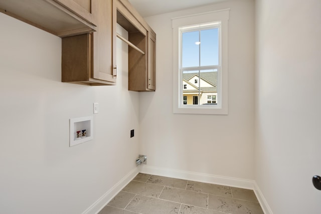 laundry area with cabinets, washer hookup, and hookup for an electric dryer