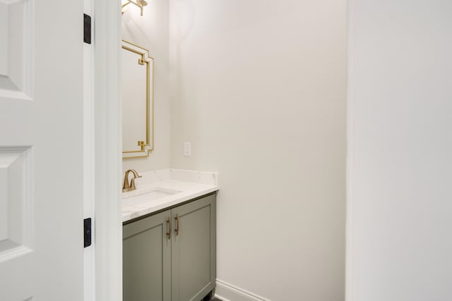 bathroom featuring vanity and baseboards