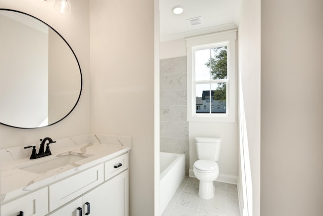 bathroom with vanity, tile patterned floors, a washtub, toilet, and tile walls