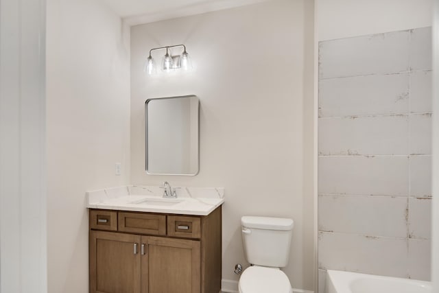 bathroom with toilet and vanity