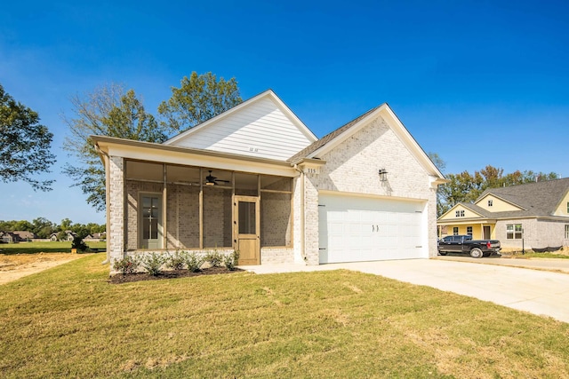 115 Independence Ln, Rossville, TN 38066 - view of front of home with brick siding, a garage, a sunroom, ceiling fan, and driveway