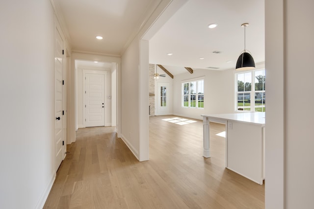 corridor with light wood finished floors, recessed lighting, visible vents, and baseboards