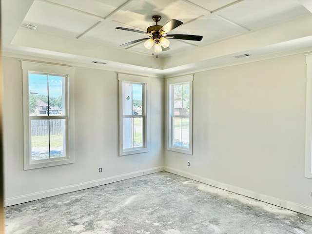 spare room featuring ceiling fan and a healthy amount of sunlight