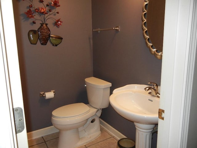 bathroom featuring tile patterned floors and toilet