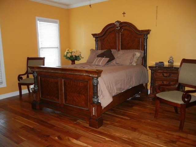 bedroom featuring dark hardwood / wood-style floors and crown molding