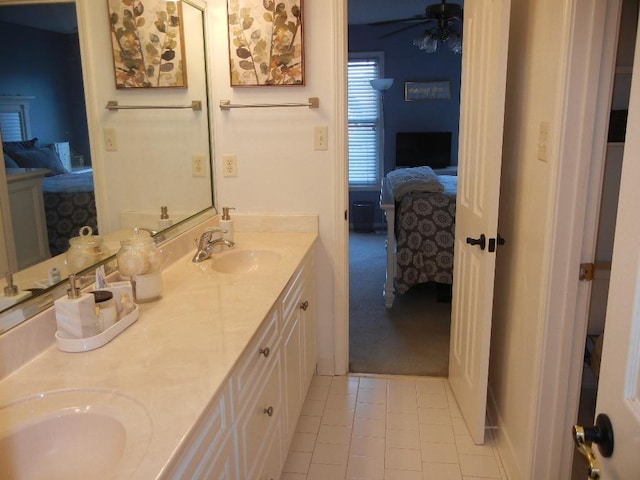 bathroom featuring tile patterned flooring, vanity, and ceiling fan