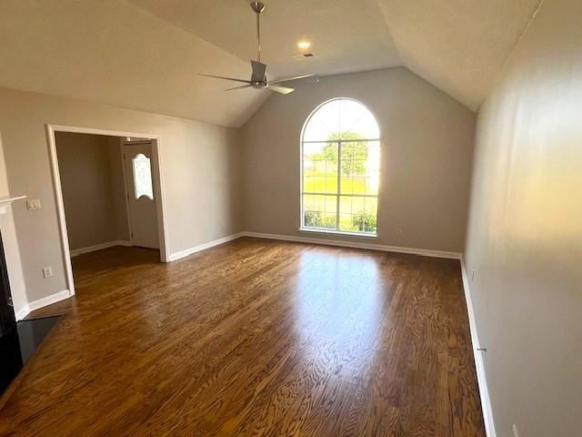 unfurnished living room featuring ceiling fan, dark hardwood / wood-style floors, and lofted ceiling