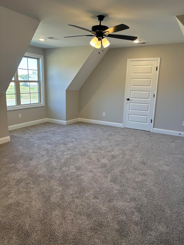 bonus room featuring ceiling fan, carpet floors, and lofted ceiling