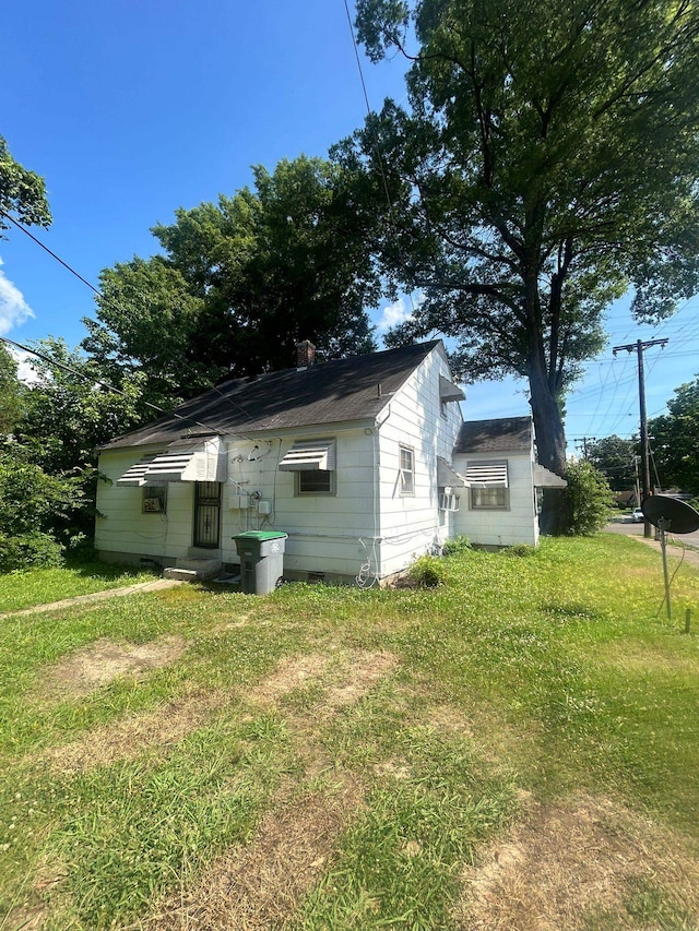 view of property exterior featuring a yard