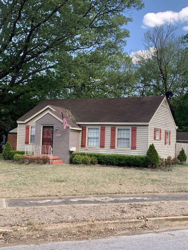 3787 Rhodes Ave, Memphis, TN 38111 - ranch-style house featuring a front yard and brick siding