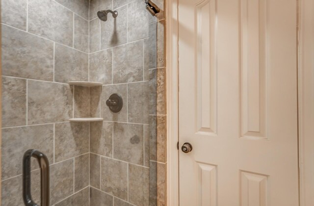 full bathroom with a tile shower