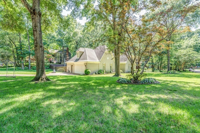 view of yard with an attached garage