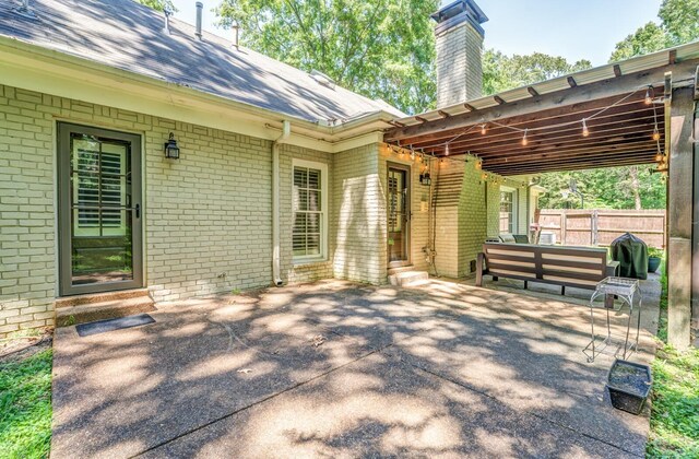 view of patio / terrace with entry steps and fence