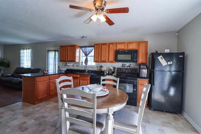 kitchen featuring black appliances, sink, tasteful backsplash, ceiling fan, and light tile floors