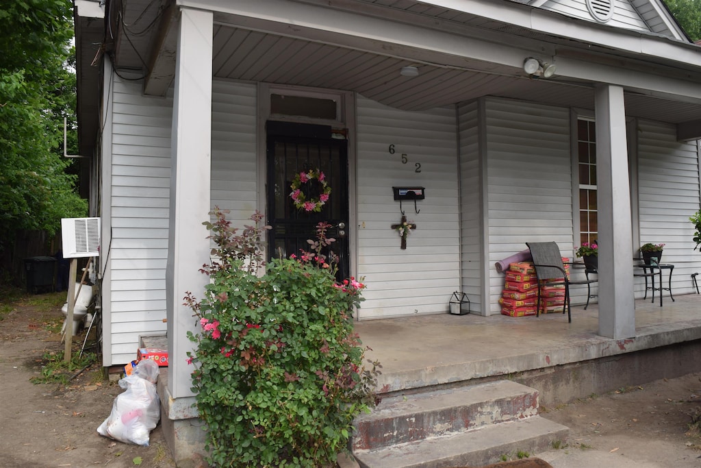 entrance to property featuring a porch