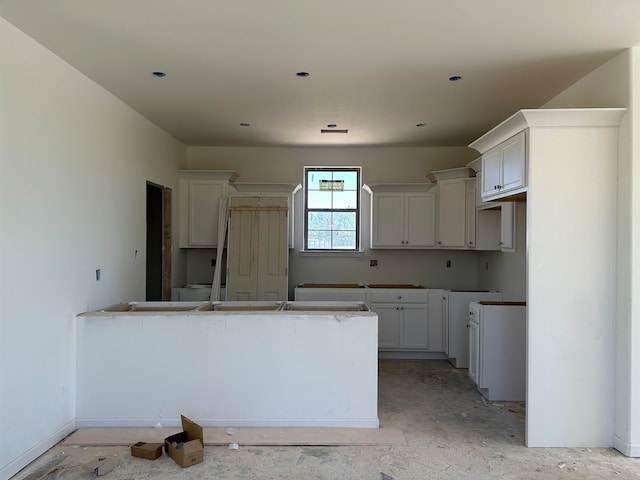 kitchen featuring white cabinets