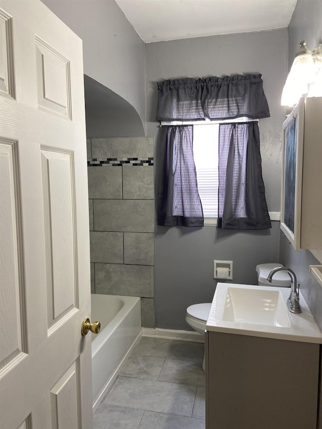 full bathroom featuring tile patterned floors, vanity, toilet, and shower / tub combination