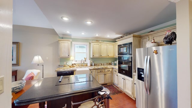 kitchen with light stone countertops, sink, dark hardwood / wood-style flooring, black appliances, and ornamental molding