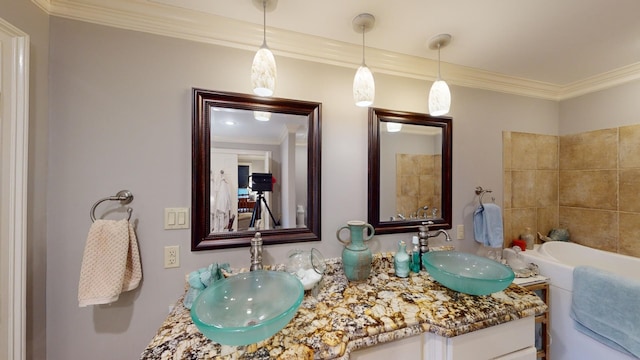 bathroom featuring vanity and ornamental molding