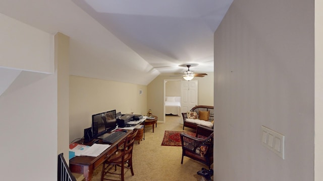 office area featuring carpet flooring, ceiling fan, and lofted ceiling