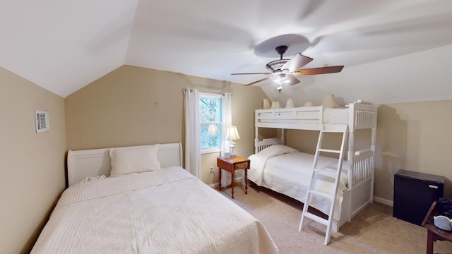 carpeted bedroom with ceiling fan and lofted ceiling