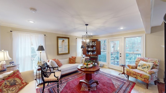 living room featuring a chandelier, light tile patterned floors, and crown molding