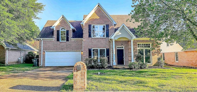 view of front facade with a front lawn and a garage