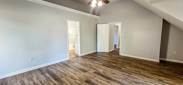 interior space with connected bathroom, ceiling fan, high vaulted ceiling, and dark hardwood / wood-style floors