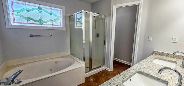 bathroom featuring tile patterned flooring, vanity, and separate shower and tub