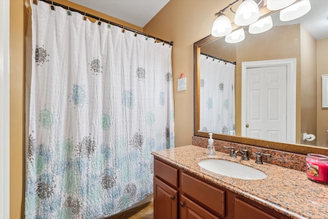 bathroom featuring vanity and an inviting chandelier