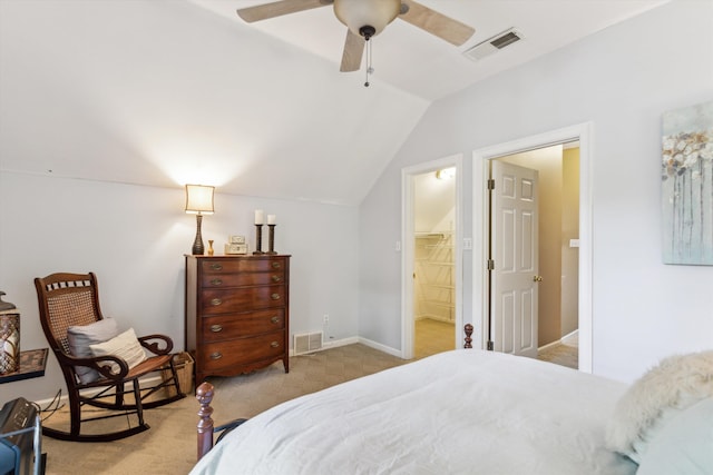 bedroom with lofted ceiling, a walk in closet, ceiling fan, light colored carpet, and a closet