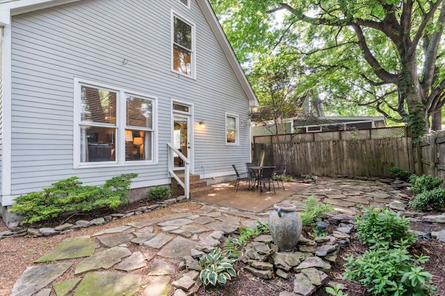 rear view of property featuring a patio area