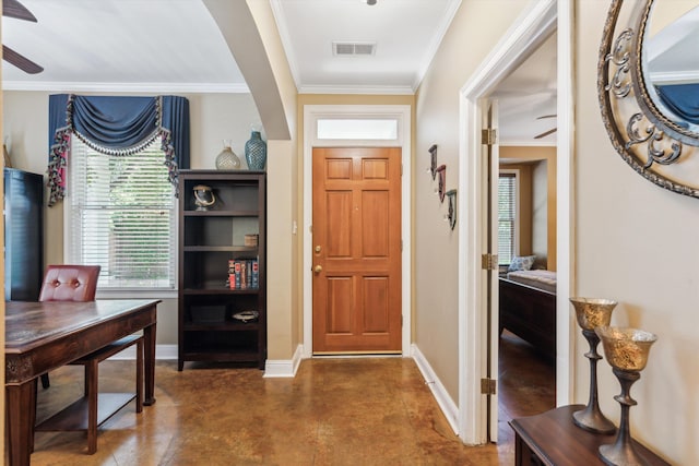 entrance foyer with ceiling fan and ornamental molding