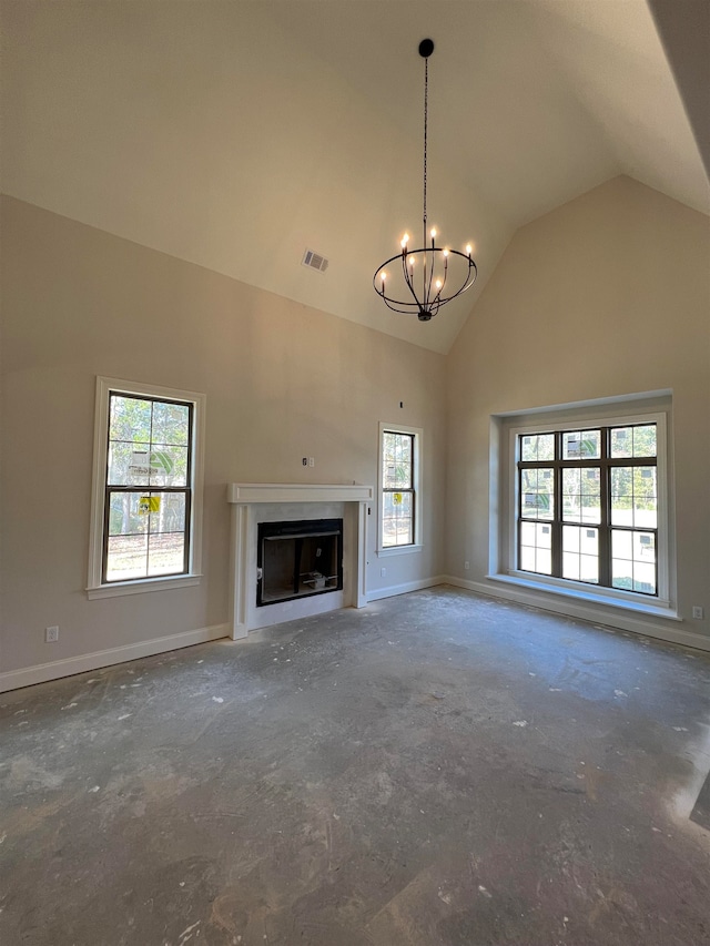 unfurnished living room with vaulted ceiling and an inviting chandelier