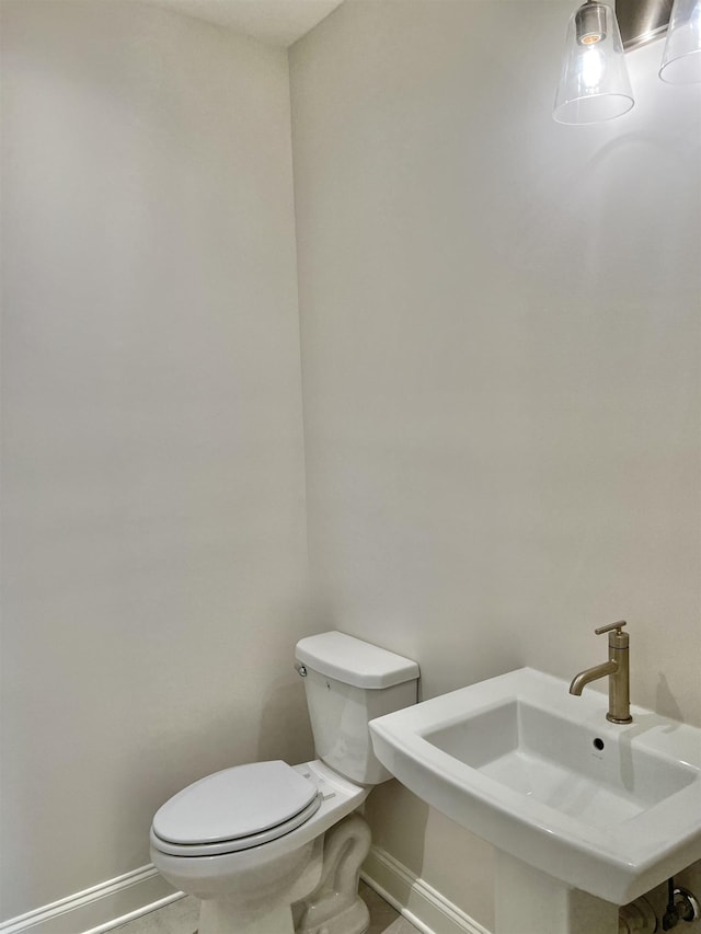 bathroom with toilet and sink