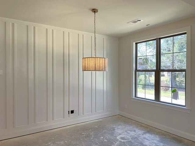 unfurnished dining area featuring a healthy amount of sunlight