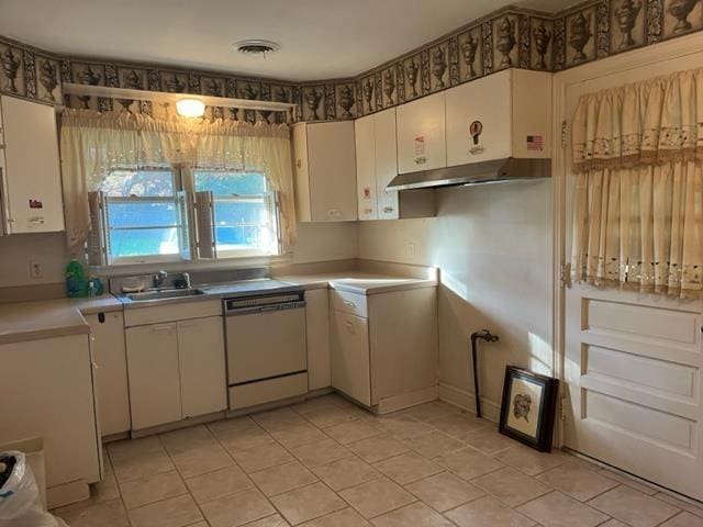 kitchen featuring white cabinets, white dishwasher, and sink