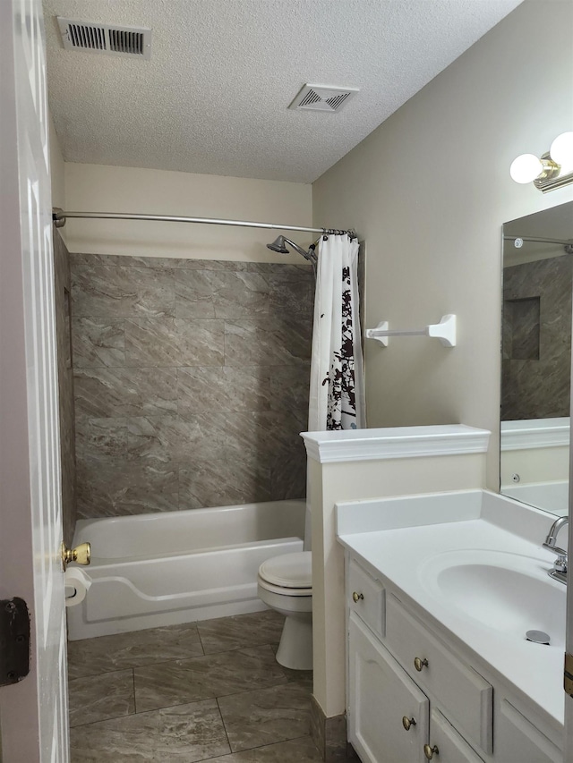 full bathroom with vanity, toilet, shower / bathtub combination with curtain, and a textured ceiling