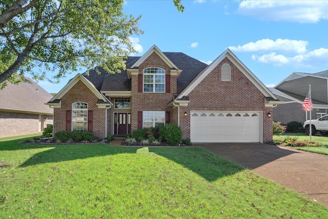 front of property featuring a garage and a front yard