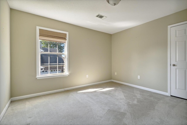 empty room with light colored carpet